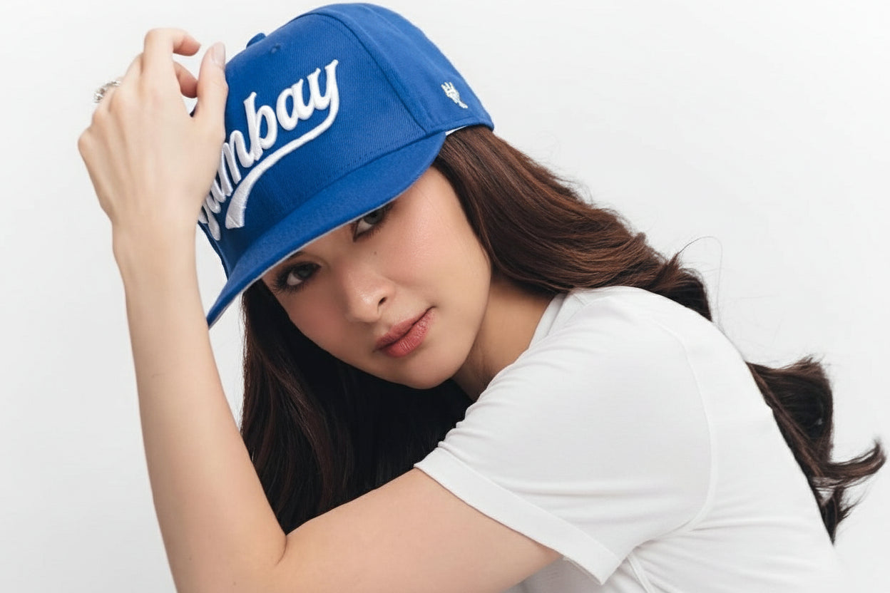 Marian Rivera wearing a V20 with 'Tambay' branding, sitting against a white background